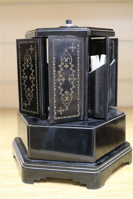 A bakelite musical cigarette dispenser and a similar Crown Derby pottery kennel, 21cm.